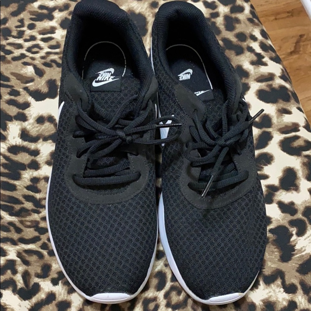Woman’s Nike sneakers worn a few times.